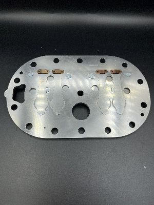 Plaque de soupape de compresseur en acier inoxydable avec limiteur et régulateur de pression par procédé de moulage pour applications industrielles